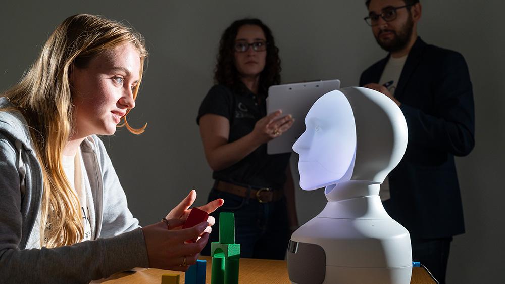 Student interacting wiht a robot